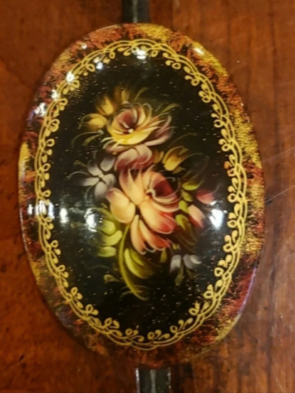 Vintage '96 Oval Black Floral Brooch with Gold Accents